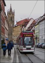 Tram N 616 is running through Johannesstrae in Erfurt with the Johanneskirchturm in the background on December 26th, 2012.