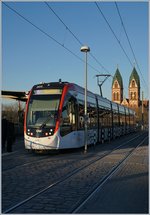 A VAG tram service to Rieselfeld (Linie n° 5) by< the Freiburg Main Station.