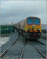 By a heavy rain is a arriving the  IR CC 224 with his Inter City from Dublin in the Galway Station.