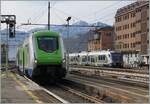 A Trenord ETR 421  ROCK  is arriving at Domodossola. In the background is waiting a FS Treniatlia MD Aln 501  Minuetto . 

02.02.2024
