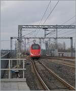 The FS Trenitalia ETR 500 037 is on the way to Milano and leaves the Reggio Emilias AV Station.