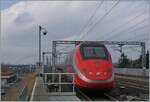 The FS Trenitalia ETR 500 037 is on the way to Milano and leaves the Reggio Emilias AV Station.