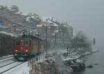 Lavaux Re 4/4 II with a cargo train by St-Saphorin. 
04.01.2010