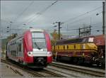 Z 2202 is leaving the station of Ettelbrck on its way to Diekirch, while 1805 is waiting for departure with freight wagons on November 6th, 2009.