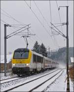 The IR 116 Luxembourg City - Liers is running through the snowy landscape in Enscherange on January 22nd, 2013.
