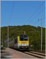 3015 is hauling the IR 117 Liers - Luxembourg City through Erpeldange/Ettelbrck on October 15th, 2011.