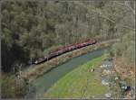 A push-pull train is running along the river Sre near Bourscheid on March 29th, 2009.