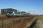TCS 101001 hauls a greenCityTrip overnight train through Tilburg-Reeshof om 18 March 2022.