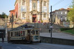 Tramway passing Santo Ildefonso church in Porto (Praça da batalha, April 2015).