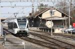 Stadler GTW leaving Buelach - note the nice freight shed ...