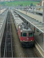 Re 4/4 II 11251 with a local train pictured at ...