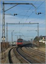 Re 460 052-4 pushes the 'Jumbo' IC 710 to Gen�ve-A�roport. 
Pictured by Neyruz, 12.03.2012