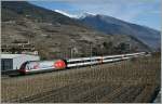 Re 460 The celeb re 'snow train' for british Guest in the 'Walliser-Alps' area on the way to Geneva Airport by Salgesch.
05.03.2011