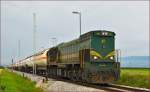 Diesel loc 664-106 pull freight train through Cirkovce-Polje on the way to Hodoš. /5.8.2014