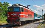 Electric loc 342-001 pull passenger train through Maribor-Tabor on the way to Maribor station. /1.7.2014