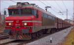 Electric loc 363-013 is hauling freight train through Maribor-Tabor on the way to Koper port. /27.12.2013