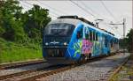 Multiple units 312-004 run through Maribor-Tabor on the way to Maribor station. /24.7.2014