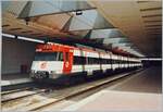 The RENFE railcar 9-446-324-6 is parked in the Barcelona airport train station.
These three-part suburban railcars were built between 1989 and 1993, so the railcar was still quite new at the time the photo was taken.

Analogue picture from May 1993