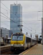 Serie 13 HLE 1353 with the IC A Eupen - Oostende is leaving the station Bruxelles Midi on February 6th, 2011.