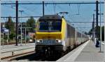 Serie 13 HLE 1348 is heading the IC A Eupen - Oostende in Welkenraedt on August 20th, 2011.