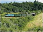 Serie 15 HLE 1501 with heritage M 2 wagons is leaving the tunnel near Von�che on June 28th, 2008.