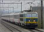 Serie 20 2002 is hauling the IC 97 'Iris' through the station of Hollerich on March 1st, 2009.