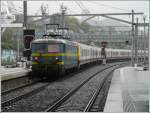 Serie 22 It's raining cats and dogs on September 12th, 2008 in Li�ge and a very long special train has to be pushed up the ramp to Ans by the helper engine HLE 2226.
