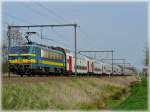 Serie 27 HLE 2760 is heading the double train to Blankenberge and Knokke in Hansbeke on April 10th, 2009.