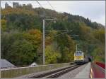 Serie 3000 3003 has left the tunnel Bourscheid and is now crossing the S�re bridge, while the castle of Bourscheid is dominating the autumnal landscape on October 25th, 2009. 