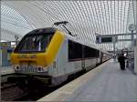 Serie 3000 3003 is leaving the station Li�ge Guillemins in order to continue its way to Liers on February 6th, 2011.