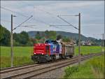 Am 843 091-0 is hauling a goods wagon through Bietingen on September 11th, 2012.