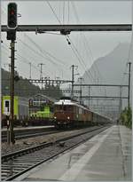 A BLS heritage train with two Ae 6/8 is arriving at Kandersteg.
