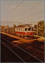 The SBB Re 4/4 I 10033 wiht a Fast Train Service from Delémont to Biel/Bienne in Lengnau. 

16.07.1984
