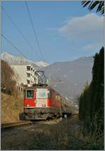 The SBB Re 4/4 II 11148 is approaching Locarno with his IR. 
23.01.2012