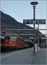 SBB Re 4/4 II 11148 with the IR 1403 to Brig by the stop in Visp.