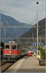 The SBB Re 4/4 II 11132 with a  Gotthard fast Train/IR  is arriving at Bellinzona.