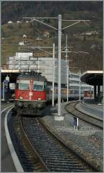 SBB Re 4/4 II 11151 with a REX St Gallen - Chur by the stop in Sargans.