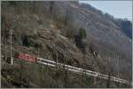 A Re 4/4 II wiht an IR in the  Biaschian  (Gotthard South Line)  03.04.2013