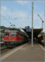 Re 4/4 II 11127 and an other one wiht the IR 2316 Lugano - Basel in Bellinzona.