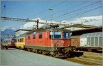 SBB Re 4/4 II 11229 wiht a EC to Milan by his stop in Sion.
Analog picture / spring 1998