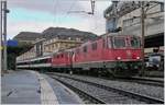 The SBB Re 4/4 II 11197 (UIC 91 85 4420 197-6 CH-SBB) and 11199 (UIC 91 85 4420 119-2 CH-SBB) with a passenger train in Lausanne.