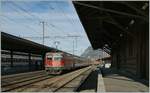 The SBB Re 4/4 II 11124 is arriving at the Landquart Station wiht his RE St.Gallen - Chur.

01.12.2011