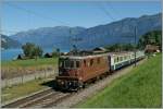 BLS Re 4/4 194 with a local train from Spiez to Interlaken by Faulensee.