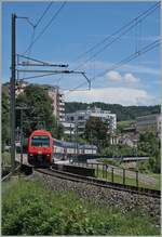 A SBB Re 450 by the Neuhausen Rhienfall Station.