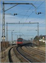 Re 460 052-4 pushes the  Jumbo  IC 710 to Genve-Aroport. 
Pictured by Neyruz, 12.03.2012