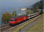 The SBB RE 460 008-6 wit an IR to Brig by the Chastle of Chillon.