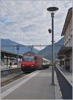 The SBB Re 460 001-1 with a IC to Lugano in Giubisaco.