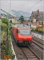 A SBB Re 460 wiht his IR 90 on the way to Brig is shortly arriving at Montreux.