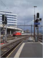 A SBB IC to St Gallen is leaving the Lausanne Station. 

26.02.2020
