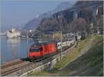 A SBB Re 460 with his IR 90 from Geneva to Brig near the Castle of Chillon.